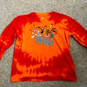 This is a soft fabric loony tunes shirt by Warner brothers